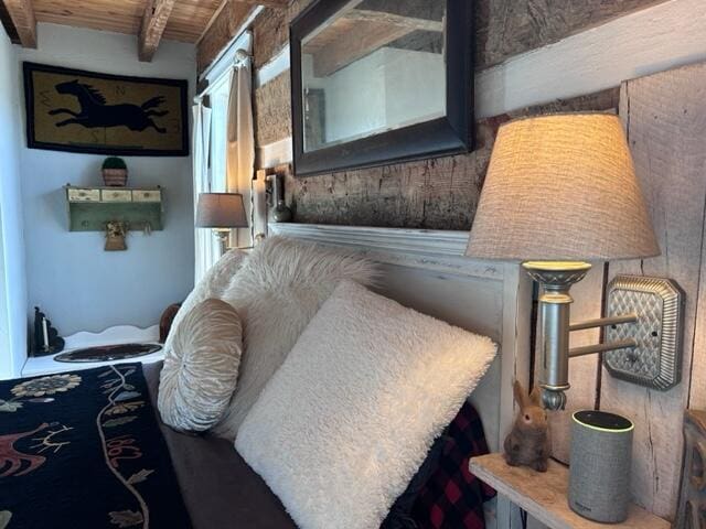 bedroom with wooden ceiling and beam ceiling