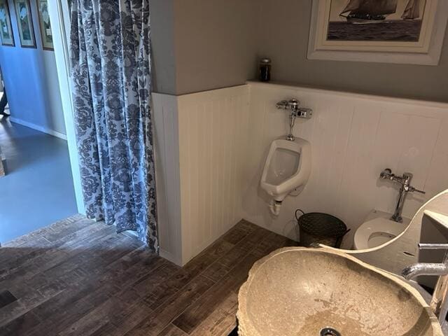 bathroom featuring toilet and hardwood / wood-style floors