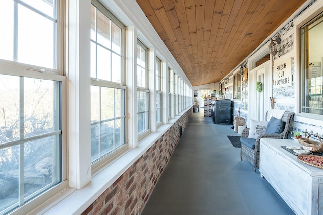 sunroom featuring wooden ceiling