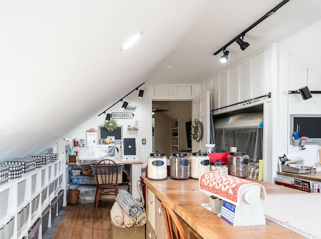 kitchen with rail lighting, hardwood / wood-style floors, and wooden counters