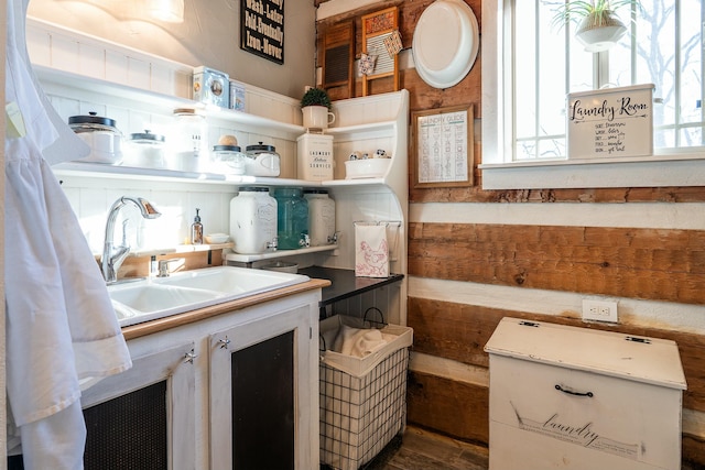 interior space with sink and white cabinetry