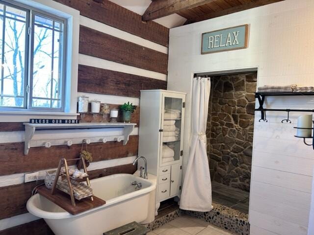 bathroom with wooden ceiling and tile patterned floors