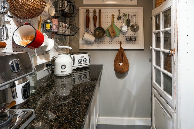 kitchen featuring dark stone counters