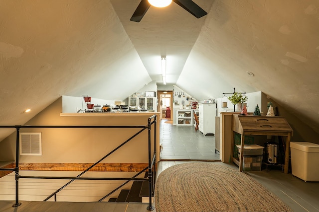 unfurnished bedroom featuring vaulted ceiling and hardwood / wood-style floors