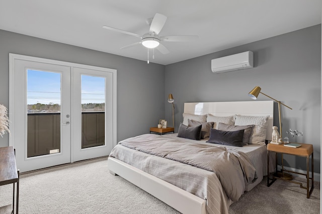 carpeted bedroom with a wall unit AC, access to exterior, ceiling fan, and french doors