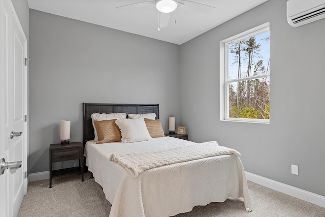 bedroom with multiple windows, ceiling fan, light colored carpet, and a wall mounted air conditioner