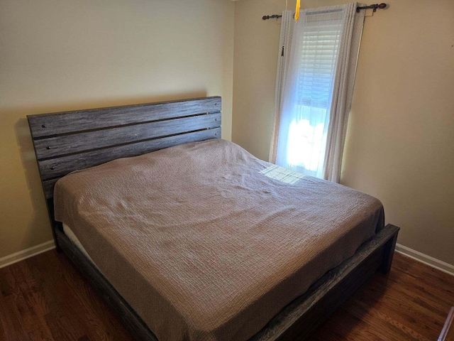 bedroom featuring dark hardwood / wood-style flooring