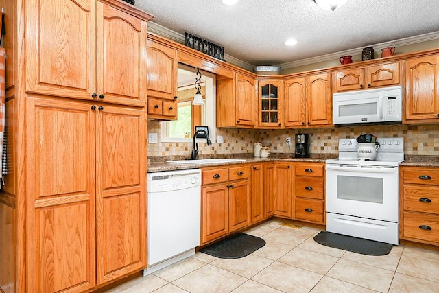 kitchen featuring sink, crown molding, a textured ceiling, white appliances, and light tile patterned floors