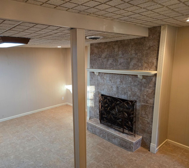 interior space featuring a tiled fireplace