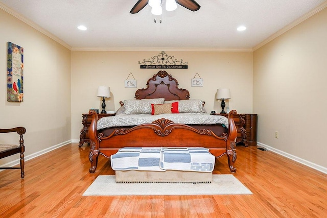 bedroom with ceiling fan, crown molding, and light hardwood / wood-style floors