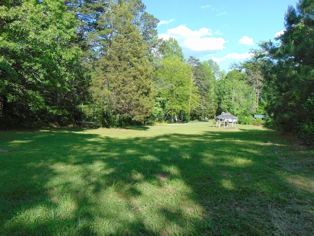 668 Mount Zion Rd NW, Georgetown, TN 37336 - view of grassy yard featuring a gazebo and a forest view