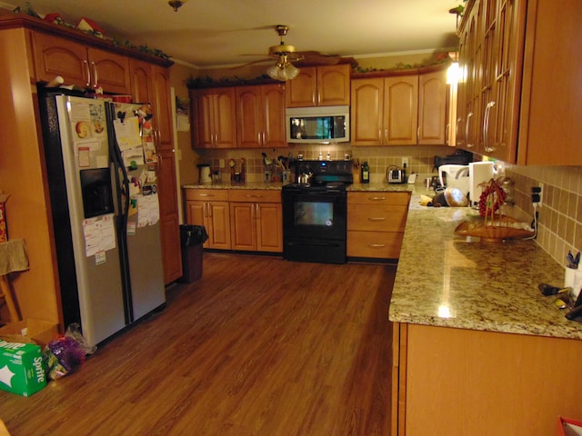 668 Mount Zion Rd NW, Georgetown, TN 37336 - kitchen featuring appliances with stainless steel finishes, decorative backsplash, a ceiling fan, dark wood-style floors, and light stone counters