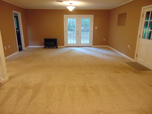668 Mount Zion Rd NW, Georgetown, TN 37336 - unfurnished living room featuring crown molding, french doors, a wood stove, and carpet
