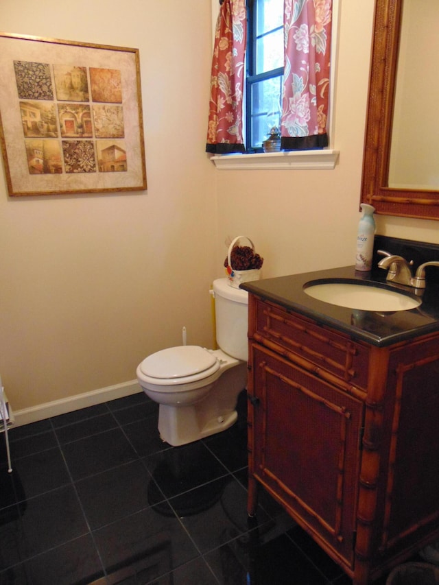 668 Mount Zion Rd NW, Georgetown, TN 37336 - half bath with vanity, toilet, tile patterned flooring, and baseboards