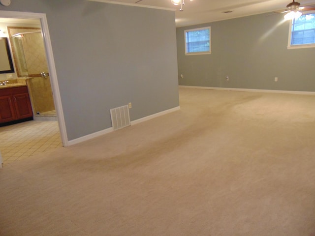 668 Mount Zion Rd NW, Georgetown, TN 37336 - below grade area featuring ceiling fan, light carpet, and plenty of natural light