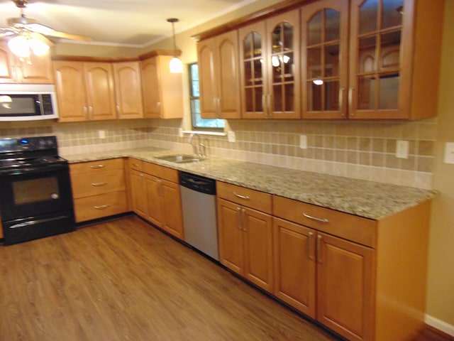 668 Mount Zion Rd NW, Georgetown, TN 37336 - kitchen with white microwave, black range with electric cooktop, dishwasher, and wood finished floors