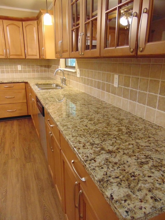 668 Mount Zion Rd NW, Georgetown, TN 37336 - kitchen featuring dishwasher, wood finished floors, light stone countertops, glass insert cabinets, and decorative backsplash