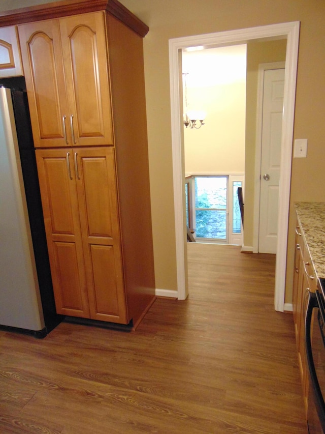 668 Mount Zion Rd NW, Georgetown, TN 37336 - kitchen featuring fridge, wood finished floors, stove, and light stone countertops