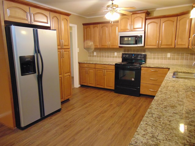 668 Mount Zion Rd NW, Georgetown, TN 37336 - kitchen with white refrigerator with ice dispenser, black / electric stove, light wood-style flooring, ornamental molding, and light stone counters