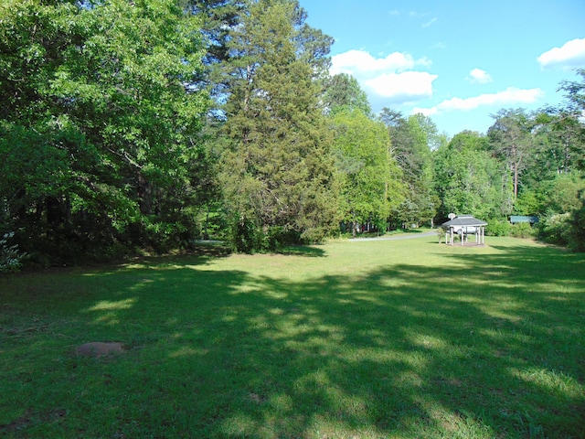 668 Mount Zion Rd NW, Georgetown, TN 37336 - view of grassy yard featuring a gazebo and a wooded view