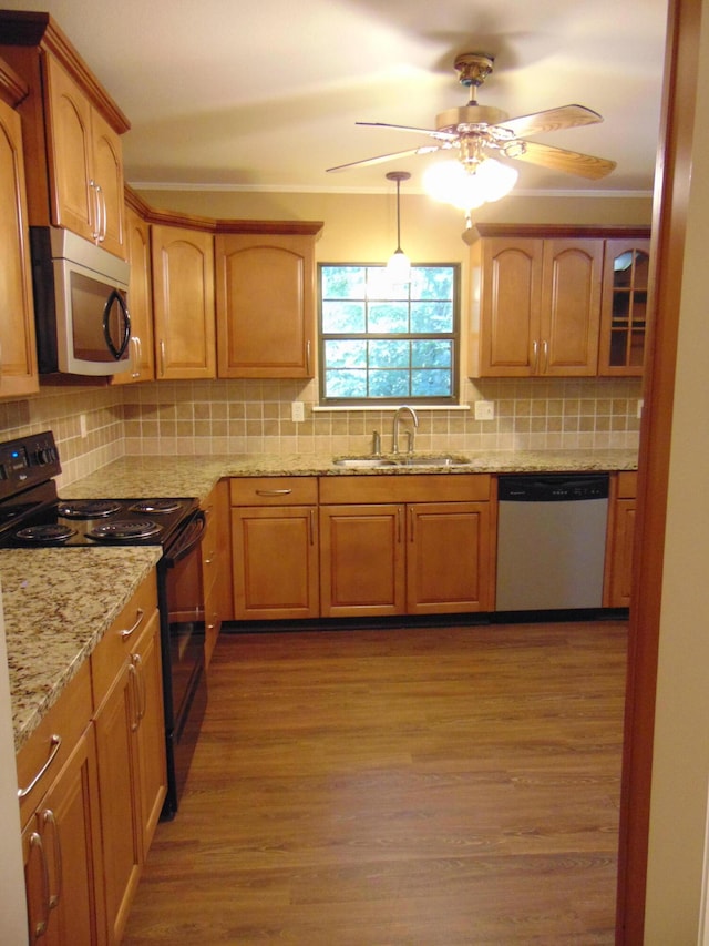 668 Mount Zion Rd NW, Georgetown, TN 37336 - kitchen featuring stainless steel appliances, wood finished floors, backsplash, light stone counters, and a ceiling fan