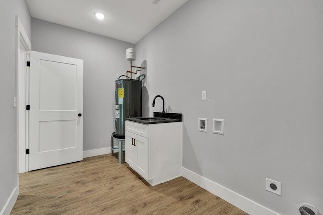 bathroom featuring marble finish floor, shower / tub combination, a sink, and toilet