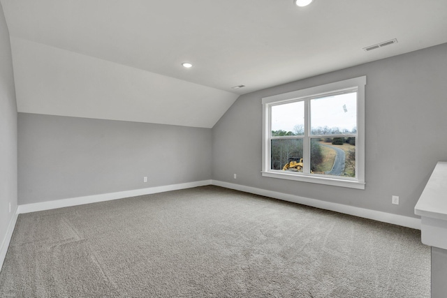 bonus room with recessed lighting, carpet flooring, visible vents, baseboards, and vaulted ceiling