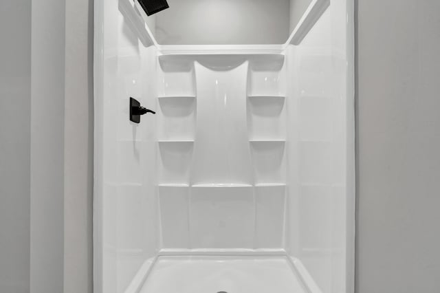 bathroom featuring a stall shower