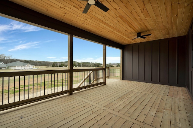 wooden terrace with a ceiling fan