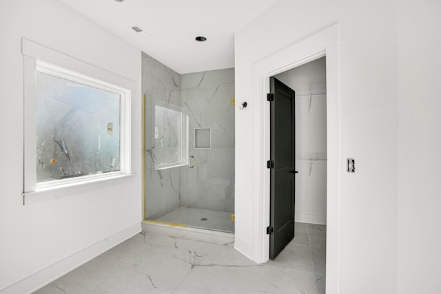 bathroom featuring an enclosed shower