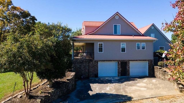 view of side of home featuring a garage