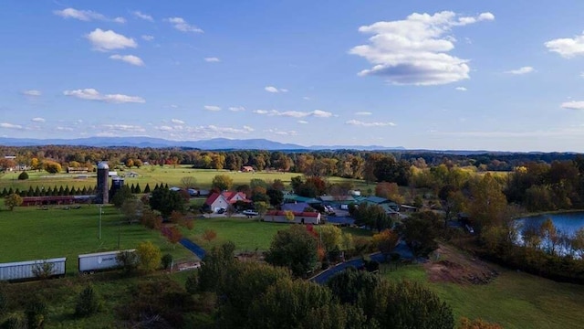 birds eye view of property with a water and mountain view and a rural view