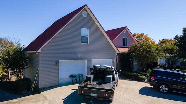 view of property exterior featuring a garage