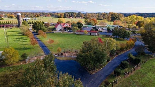 birds eye view of property with a rural view