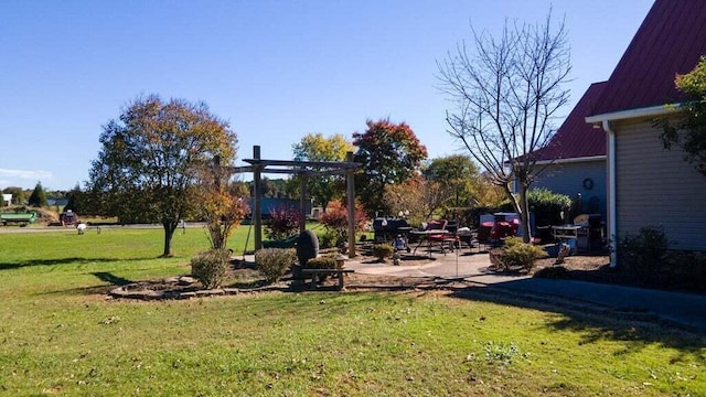 view of yard with a patio area and a pergola