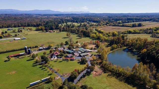 drone / aerial view with a rural view and a water and mountain view