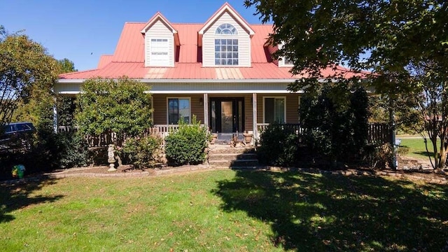 view of front facade featuring covered porch and a front yard