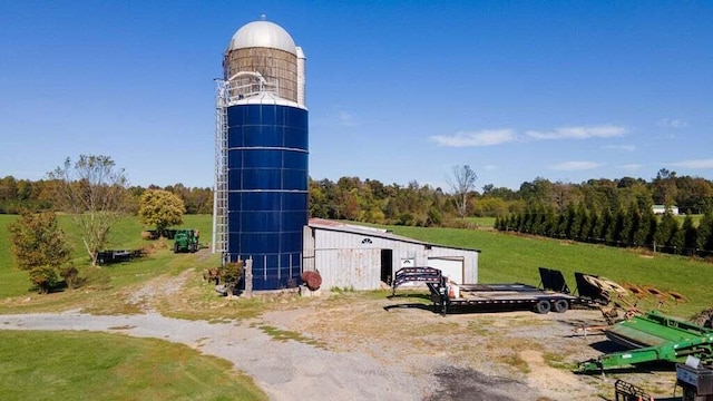 view of home's community with a rural view and an outdoor structure