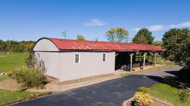 view of side of property with an outdoor structure