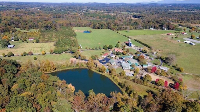 birds eye view of property featuring a rural view and a water view