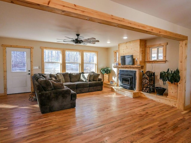 living room featuring ceiling fan and hardwood / wood-style floors