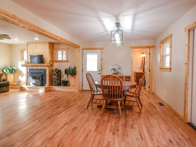 dining space featuring light wood-type flooring