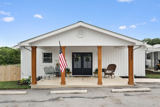 view of front facade featuring french doors and a porch