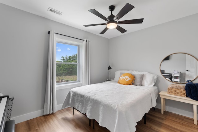 bedroom featuring ceiling fan and wood-type flooring