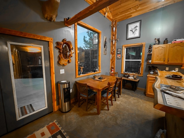 dining room with beamed ceiling and wooden ceiling