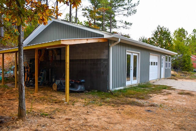 exterior space featuring an outdoor structure and a garage