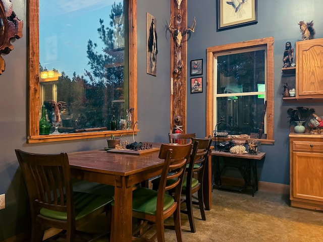 view of carpeted dining area