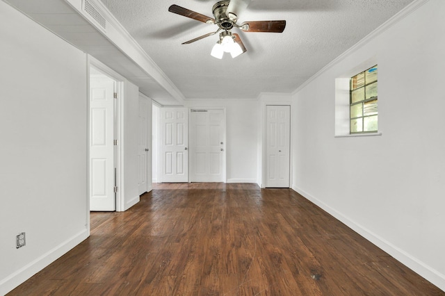 unfurnished room featuring visible vents, a textured ceiling, ceiling fan, and wood finished floors
