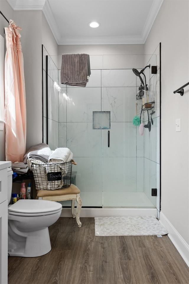 3914 Dogwood Valley Rd, Tunnel Hill, GA 30755 - bathroom with a stall shower, toilet, crown molding, and wood finished floors