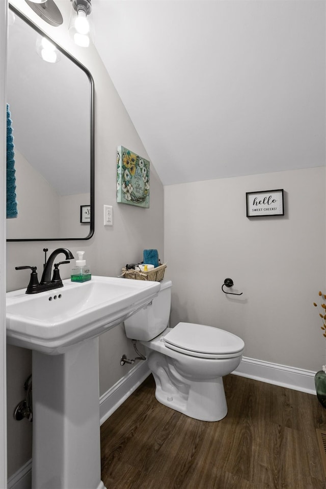3914 Dogwood Valley Rd, Tunnel Hill, GA 30755 - bathroom featuring toilet, baseboards, vaulted ceiling, and wood finished floors